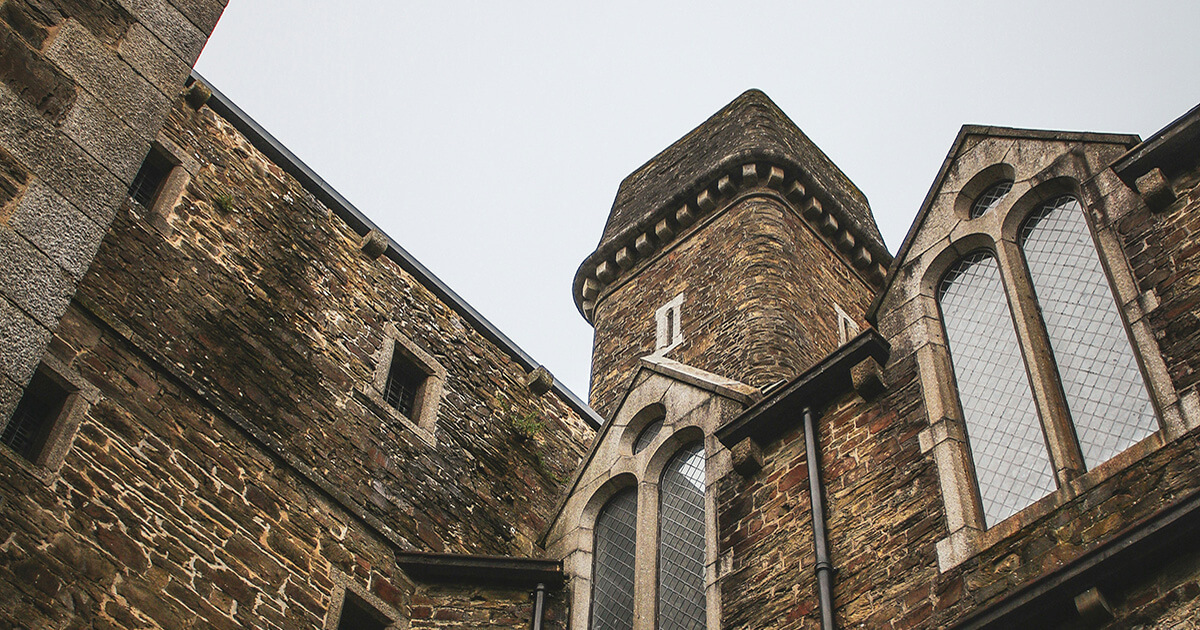 Bodmin town rooftops with church tower and Cornish hills beyond
