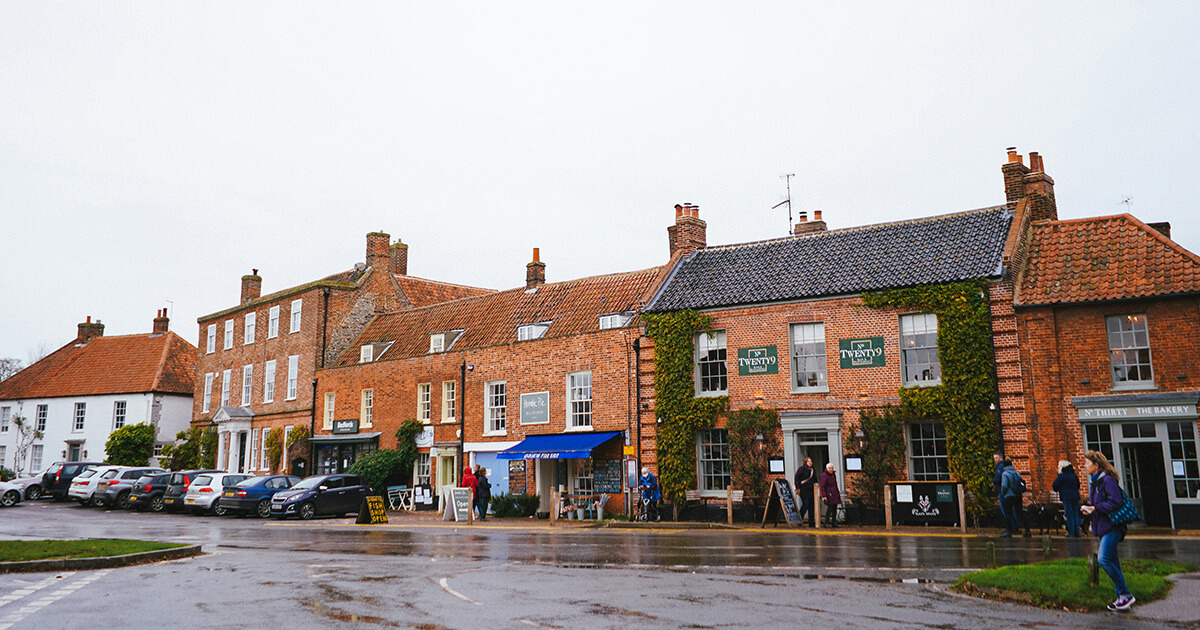 Burnham Market's wide Georgian green and historic shop fronts in north Norfolk