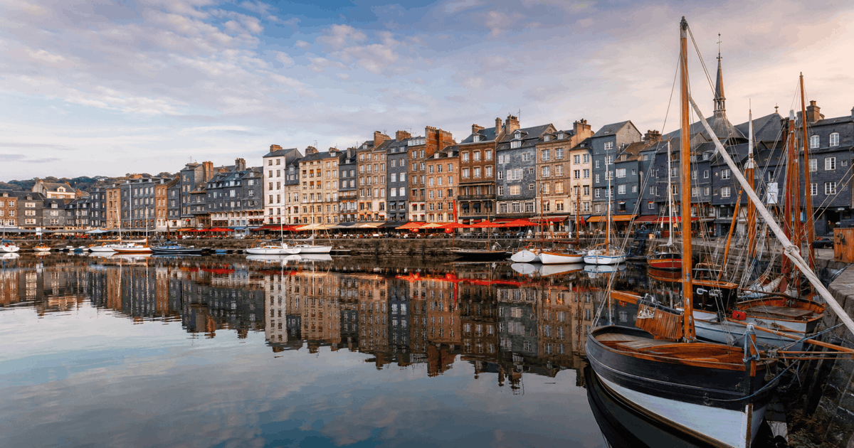 Colourful harbour houses reflected in the Vieux Bassin at Honfleur