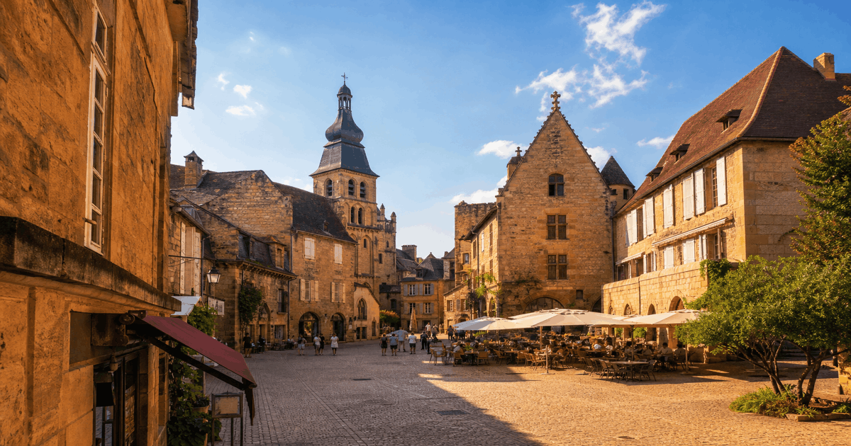 Golden limestone buildings and medieval towers in Sarlat old town